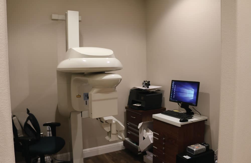 A well-organized dental office at American Family Dentistry, highlighting a desk equipped with a computer for patient management.